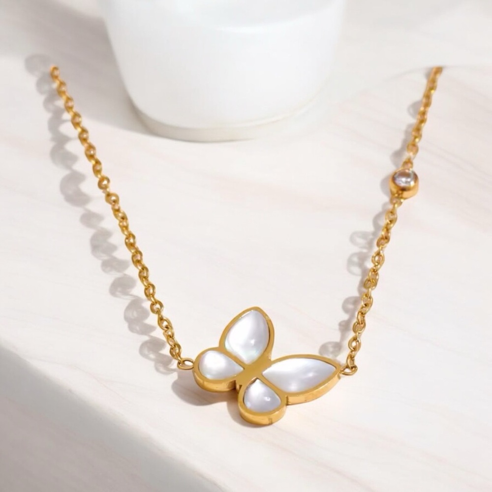 Butterfly pendant on 18k gold over stainless steel chain